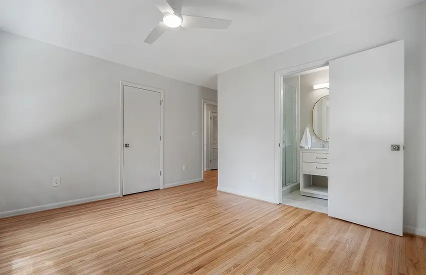 Bedroom with newly installed hardwood flooring
