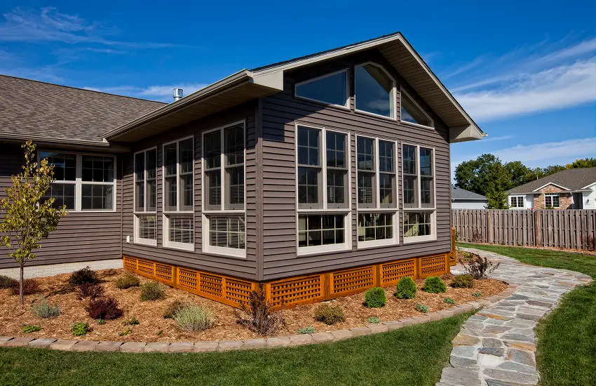 Sunroom room addition with wraparound windows