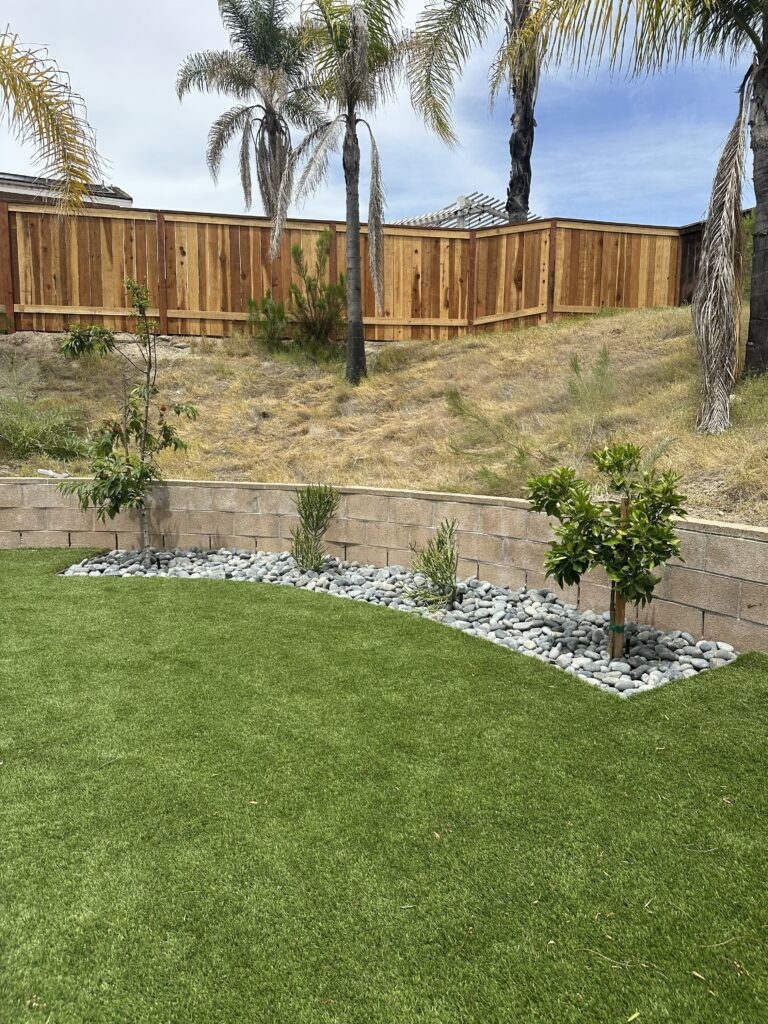 Premium Backyard Remodel: New Cedar Fence, River Rock Landscaping & Turf Install