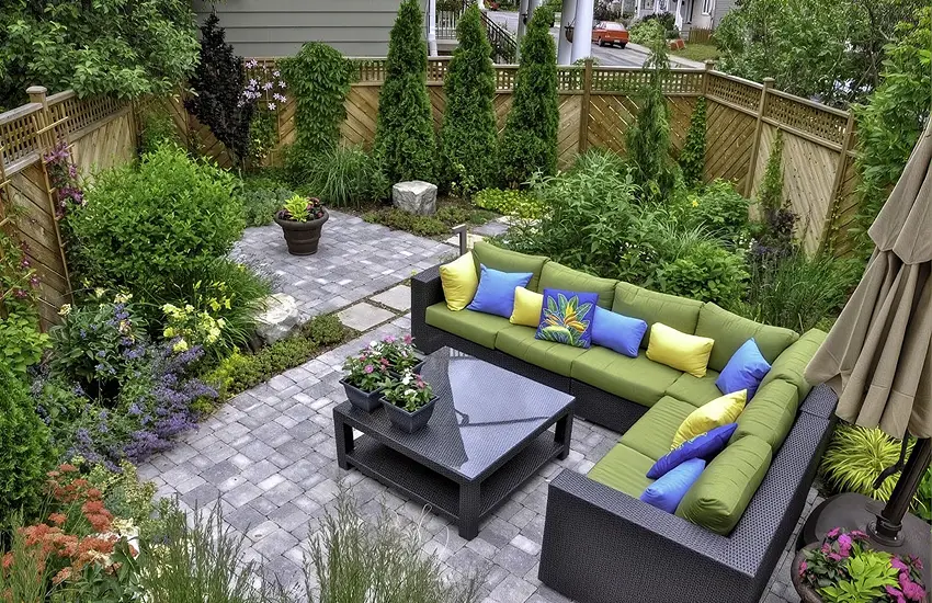 Paver patio with garden landscaping and outdoor sectional seating