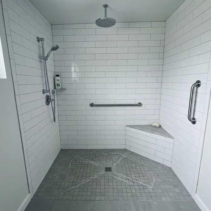Accessible curbless shower with grab bars