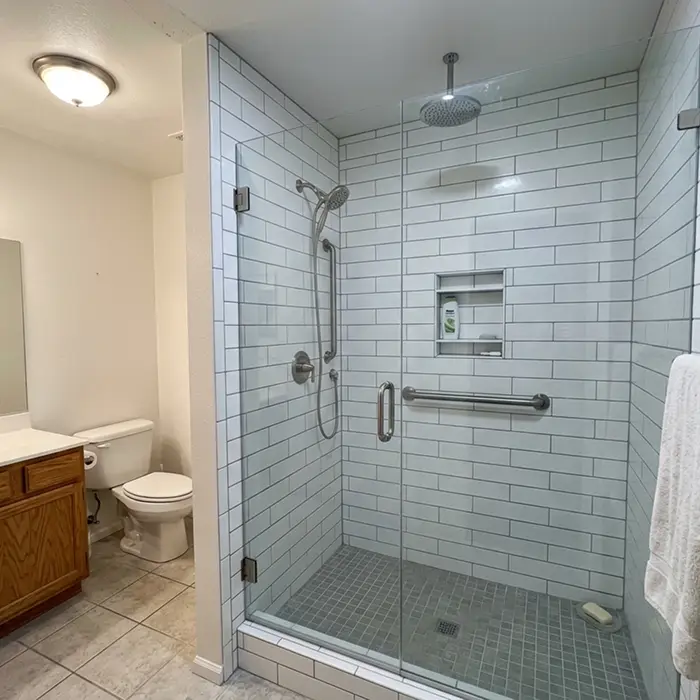 Walk-in shower after a tub-to-shower conversion