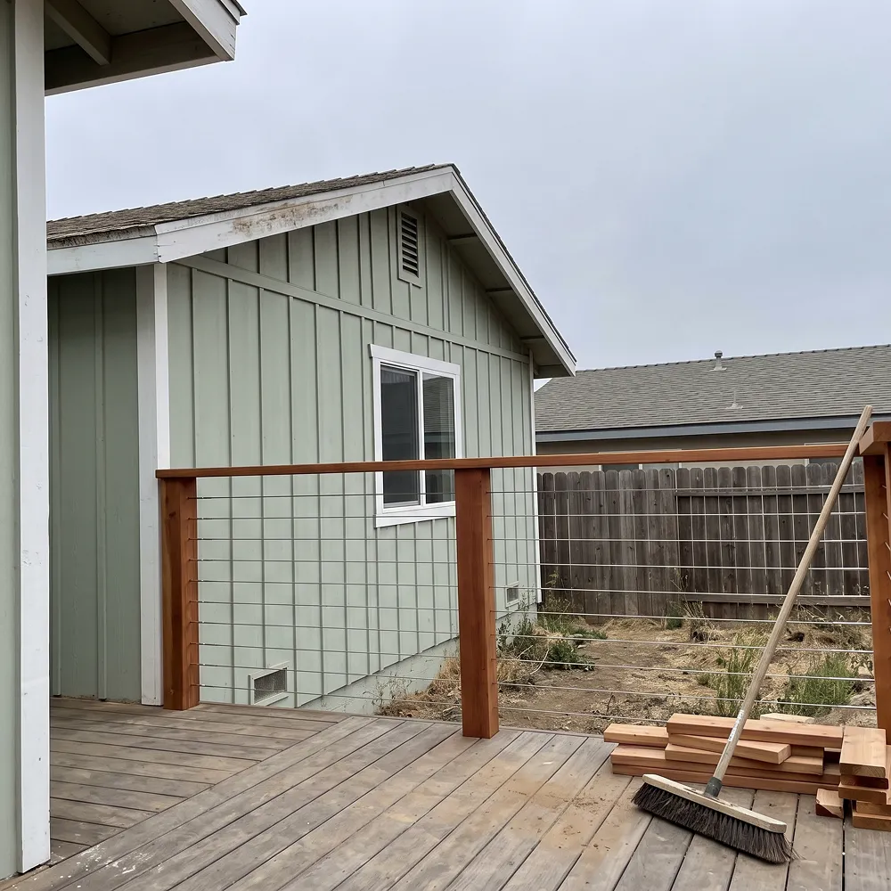 Backyard remodeling project in Chula Vista with a covered patio, outdoor seating, and drought-tolerant landscaping