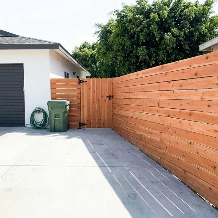 Horizontal wood fence with a front gate