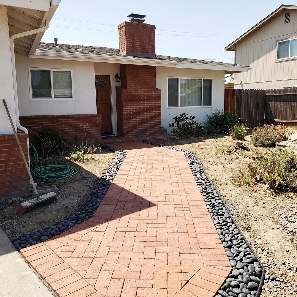 Backyard remodeling project in Chula Vista with a covered patio, outdoor seating, and drought-tolerant landscaping
