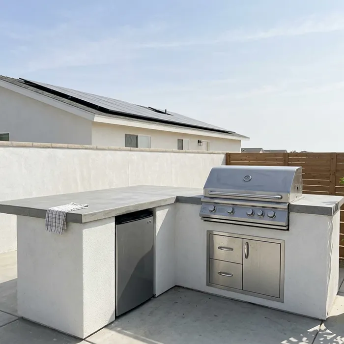 Outdoor kitchen with a built-in grill island