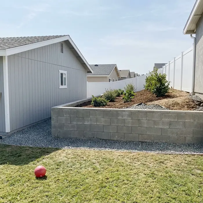 Retaining wall drainage backfill and waterproofing