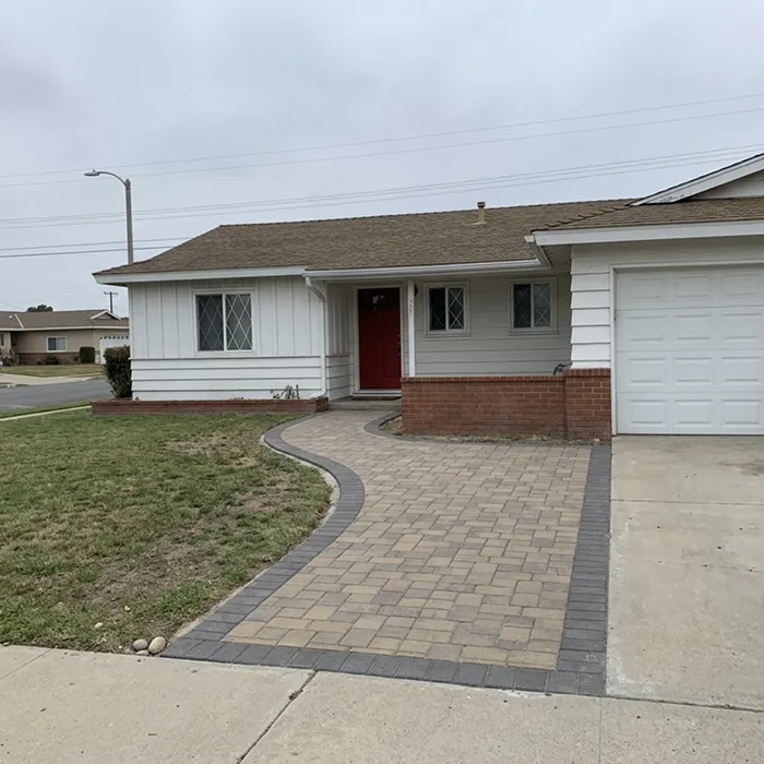 Paver walkway leading to a home's front door