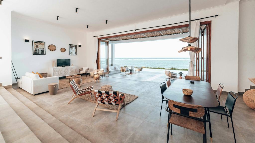 Modern San Diego remodeling project featuring an open-concept living space with ocean views, large glass doors, and contemporary interior design